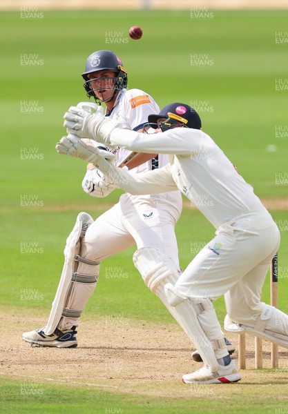 300826 Glamorgan v Hampshire, Rothesay County Championship Division 1 - Eddie Jack of Hampshire hits a four over the head of Chris Cooke of Glamorgan