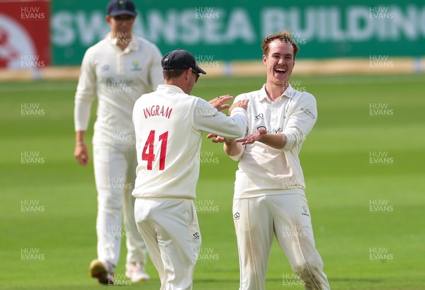 300826 Glamorgan v Hampshire, Rothesay County Championship Division 1 - Ben Kellaway of Glamorgan  celebrates with Colin Ingram of Glamorgan after taking the wicket of James Fuller of Hampshire