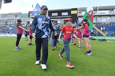 060725 - Glamorgan v Kent - T20, Vitality Blast - Kiran Carlson of Glamorgan runs out for the start of the match