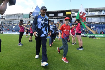 060725 - Glamorgan v Kent - T20, Vitality Blast - Kiran Carlson of Glamorgan runs out for the start of the match