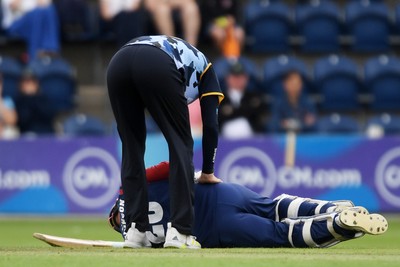 060725 - Glamorgan v Kent - T20, Vitality Blast - Matt Parkinson of Kent goes down after he is hit with the ball  