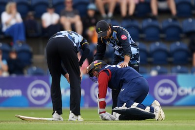 060725 - Glamorgan v Kent - T20, Vitality Blast - Matt Parkinson of Kent goes down after he is hit with the ball  