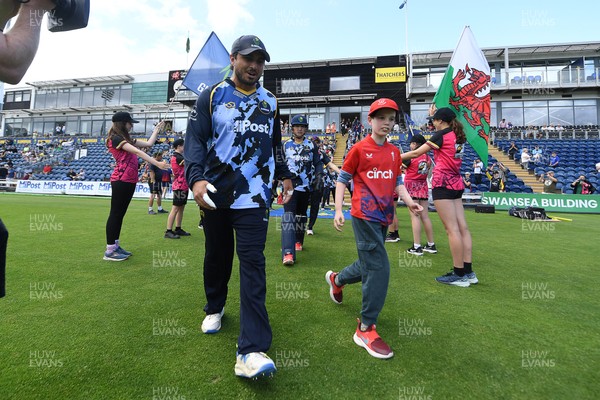 060725 - Glamorgan v Kent - T20, Vitality Blast - Kiran Carlson of Glamorgan runs out for the start of the match