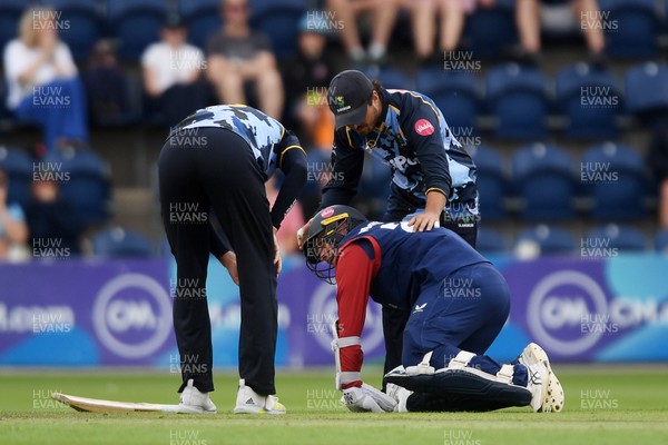 060725 - Glamorgan v Kent - T20, Vitality Blast - Matt Parkinson of Kent goes down after he is hit with the ball  