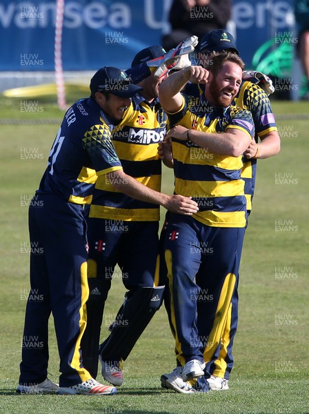 140517 - Glamorgan v Kent - Royal London One-Day Cup - David Lloyd of Glamorgan celebrates with team mates after bowling out Charlie Hartley of Kent