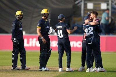 160621 - Glamorgan v Kent - T20 Vitality Blast - James Weighell of Glamorgan and Prim Sisodiya of Glamorgan look dejected as Kent players celebrate