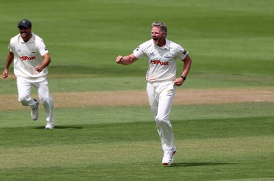 220725 - Glamorgan v Kent - Rothesay County Championship Division 2 - Timm Van Der Gugten of Glamorgan celebrates after Joey Evison is caught by Chris Cooke
