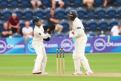 240725  Glamorgan v Kent, Rothesay County Championship Division 2, Day 3 - Alex Horton of Glamorgan takes the ball as Daniel Bell-Drummond of Kent looks on