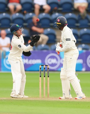 240725  Glamorgan v Kent, Rothesay County Championship Division 2, Day 3 - Alex Horton of Glamorgan takes the ball as Daniel Bell-Drummond of Kent looks on