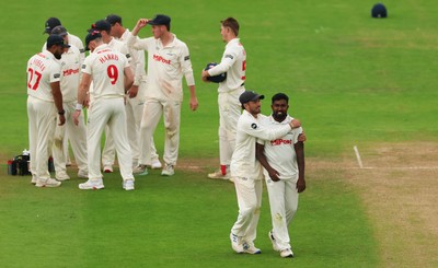 240725  Glamorgan v Kent, Rothesay County Championship Division 2, Day 3 - Asitha Fernando of Glamorgan is congratulated by Kiran Carlson of Glamorgan after he bowls Matt Parkinson of Kent