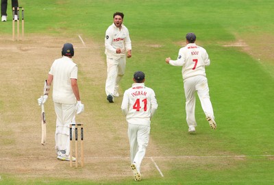 240725  Glamorgan v Kent, Rothesay County Championship Division 2, Day 3 - Kiran Carlson of Glamorgan and Billy Root of Glamorgan celebrate as they combine to dismiss Matt Quinn of Kent