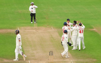 240725  Glamorgan v Kent, Rothesay County Championship Division 2, Day 3 - Kiran Carlson of Glamorgan and Billy Root of Glamorgan celebrate as they combine to dismiss Matt Quinn of Kent