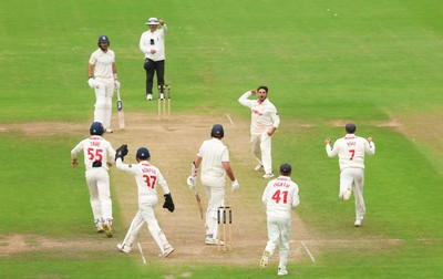 240725  Glamorgan v Kent, Rothesay County Championship Division 2, Day 3 - Kiran Carlson of Glamorgan and Billy Root of Glamorgan celebrate as they combine to dismiss Matt Quinn of Kent
