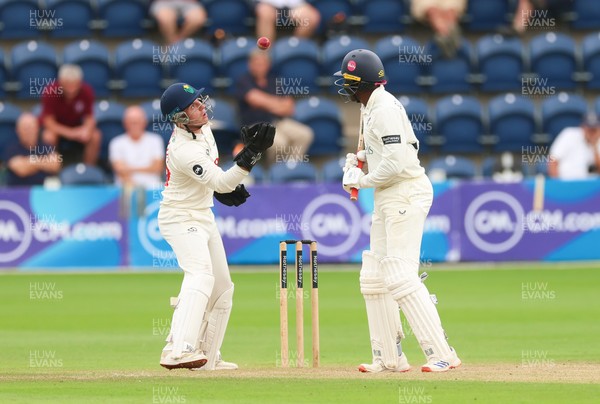 240725  Glamorgan v Kent, Rothesay County Championship Division 2, Day 3 - Alex Horton of Glamorgan takes the ball as Daniel Bell-Drummond of Kent looks on