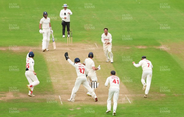 240725  Glamorgan v Kent, Rothesay County Championship Division 2, Day 3 - Kiran Carlson of Glamorgan and Billy Root of Glamorgan celebrate as they combine to dismiss Matt Quinn of Kent