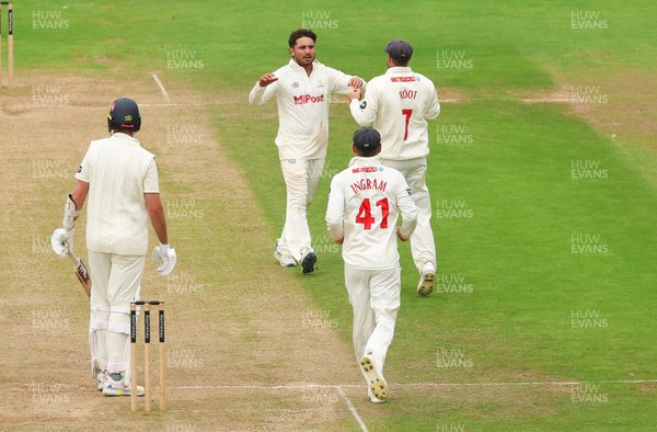 240725  Glamorgan v Kent, Rothesay County Championship Division 2, Day 3 - Kiran Carlson of Glamorgan and Billy Root of Glamorgan celebrate as they combine to dismiss Matt Quinn of Kent