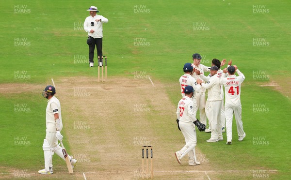 240725  Glamorgan v Kent, Rothesay County Championship Division 2, Day 3 - Kiran Carlson of Glamorgan and Billy Root of Glamorgan celebrate as they combine to dismiss Matt Quinn of Kent