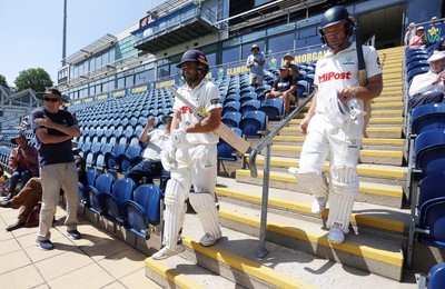 250725 - Glamorgan v Kent - Rothesay County Championship Division 2 - Kiran Carlson and Colin Ingram of Glamorgan enter the field after lunch