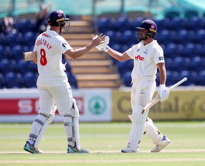 250725 - Glamorgan v Kent - Rothesay County Championship Division 2 - Ben Kellaway and Kiran Carlson of Glamorgan celebrate at the end of the match