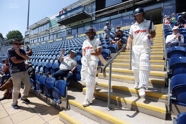 250725 - Glamorgan v Kent - Rothesay County Championship Division 2 - Kiran Carlson and Colin Ingram of Glamorgan enter the field after lunch