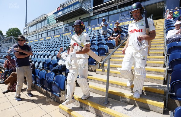 250725 - Glamorgan v Kent - Rothesay County Championship Division 2 - Kiran Carlson and Colin Ingram of Glamorgan enter the field after lunch