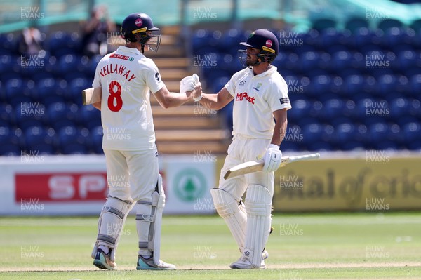 250725 - Glamorgan v Kent - Rothesay County Championship Division 2 - Ben Kellaway and Kiran Carlson of Glamorgan celebrate at the end of the match