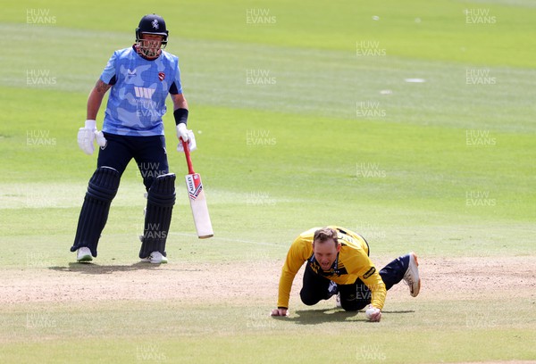040822 - Glamorgan v Kent Spitfires - Royal London One Day Cup - Colin Ingram of Glamorgan bowls and catches to dismiss Joey Evison of Kent