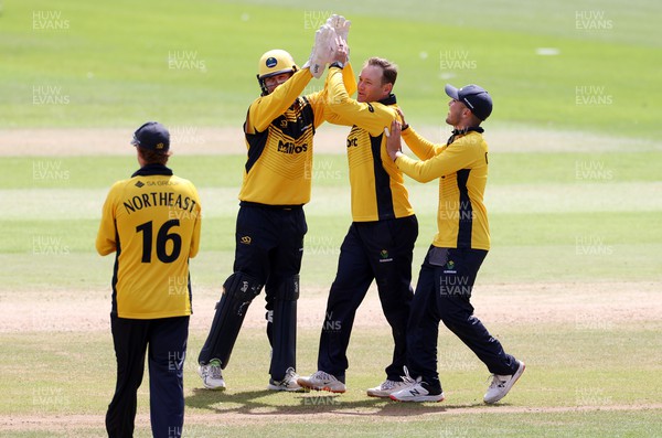 040822 - Glamorgan v Kent Spitfires - Royal London One Day Cup - Colin Ingram of Glamorgan celebrates with team mates as he bowls and catches to dismiss Joey Evison of Kent