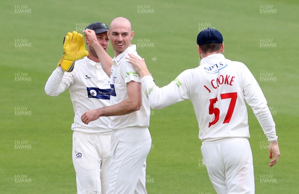 030621 - Glamorgan v Lancashire - LV= County Championship - James Weighell of Glamorgan celebrates after bowling out Luke Wells for LBW with team mates