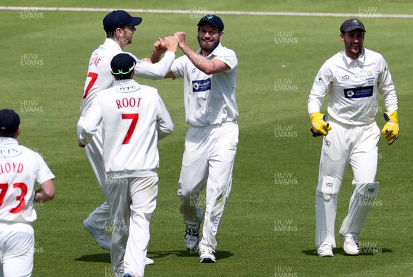 040621 - Glamorgan v Lancashire - LV= County Championship - Michael Neser of Glamorgan celebrates with team mates after catching out Liam Livingstone