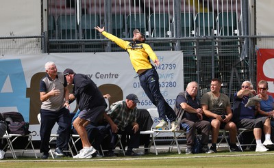 170822 - Glamorgan v Lancashire, Royal London One Day Cup - Tom Cullen of Glamorgan crashes into spectators as he attempts to catch a ball heading for a six