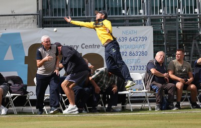 170822 - Glamorgan v Lancashire, Royal London One Day Cup - Tom Cullen of Glamorgan crashes into spectators as he attempts to catch a ball heading for a six