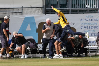 170822 - Glamorgan v Lancashire, Royal London One Day Cup - Tom Cullen of Glamorgan crashes into spectators as he attempts to catch a ball heading for a six