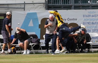 170822 - Glamorgan v Lancashire, Royal London One Day Cup - Tom Cullen of Glamorgan crashes into spectators as he attempts to catch a ball heading for a six