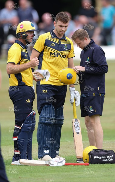 170822 - Glamorgan v Lancashire, Royal London One Day Cup - Joe Cooke of Glamorgan’s helmet is examined after it is struck by the ball as he looked to play a shot
