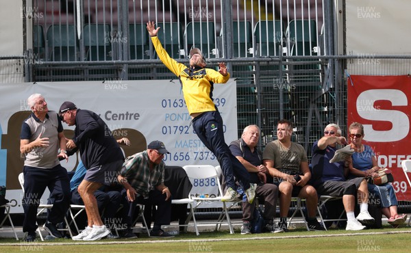 170822 - Glamorgan v Lancashire, Royal London One Day Cup - Tom Cullen of Glamorgan crashes into spectators as he attempts to catch a ball heading for a six