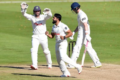 250925 - Glamorgan v Lancashire - Rothesay County Championship - Zain Ul Hassan of Glamorgan celebrates with team mates after bowling out Michael Jones of Lancashire who was LBW