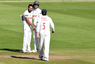 250925 - Glamorgan v Lancashire - Rothesay County Championship - Zain Ul Hassan of Glamorgan celebrates with team mates after bowling out Michael Jones of Lancashire who was LBW