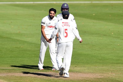 250925 - Glamorgan v Lancashire - Rothesay County Championship - Zain Ul Hassan of Glamorgan celebrates with team mates after bowling out Michael Jones of Lancashire who was LBW