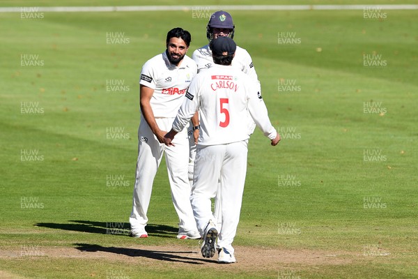 250925 - Glamorgan v Lancashire - Rothesay County Championship - Zain Ul Hassan of Glamorgan celebrates with team mates after bowling out Michael Jones of Lancashire who was LBW
