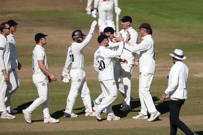 260925 - Glamorgan v Lancashire, Rothesay County Championship - Tom Hartley and Keaton Jennings celebrate after Zain ul Hassan of Glamorgan is dismissed