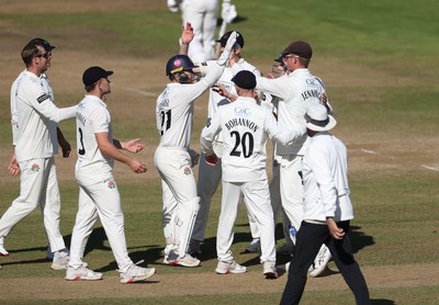 260925 - Glamorgan v Lancashire, Rothesay County Championship - Tom Hartley and Keaton Jennings celebrate after Zain ul Hassan of Glamorgan is dismissed