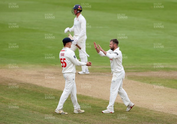 260925 - Glamorgan v Lancashire, Rothesay County Championship - Mason Crane of Glamorgan celebrates with Asa Tribe and dismissing Keaton Jennings