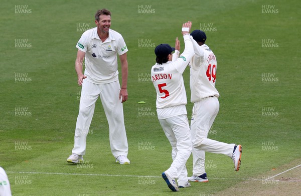060522 - Glamorgan v Leicestershire - LV= County Championship - Division Two - Michael Hogan of Glamorgan celebrates with team mates as Callum Parkinson is ran out by Marnus Labuschagne