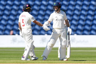 240426 - Glamorgan v Leicestershire - Rothesay County Championship - Sean Dickson of Glamorgan hits 50 and is congratulated by Kiran Carlson of Glamorgan