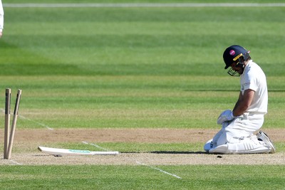 240426 - Glamorgan v Leicestershire - Rothesay County Championship - Kiran Carlson of Glamorgan is run out by Jake Weatherald of Leicestershire