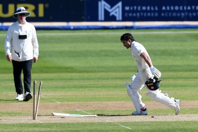 240426 - Glamorgan v Leicestershire - Rothesay County Championship - Kiran Carlson of Glamorgan is run out by Jake Weatherald of Leicestershire