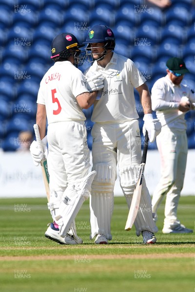 240426 - Glamorgan v Leicestershire - Rothesay County Championship - Sean Dickson of Glamorgan hits 50 and is congratulated by Kiran Carlson of Glamorgan