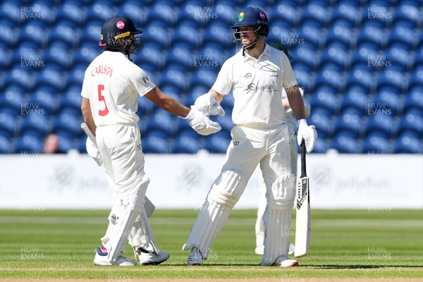 240426 - Glamorgan v Leicestershire - Rothesay County Championship - Sean Dickson of Glamorgan hits 50 and is congratulated by Kiran Carlson of Glamorgan
