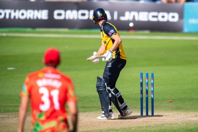 260825 - Glamorgan v Leicestershire - Metro Bank One Day Cup - Henry Hurle of Glamorgan CCC is bowled by Alex Green of Leicestershire CCC